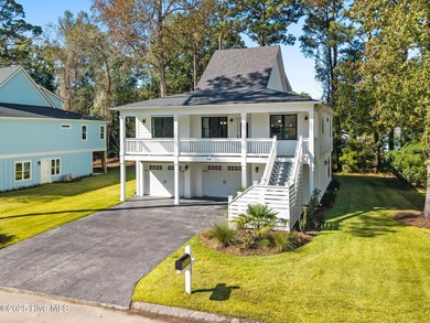 Experience the perfect blend of modern luxury and coastal charm on Brick Landing Plantation Yacht and Golf Club in North Carolina - for sale on GolfHomes.com, golf home, golf lot