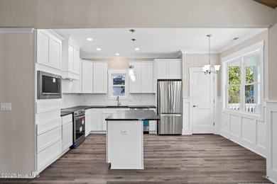 Experience the perfect blend of modern luxury and coastal charm on Brick Landing Plantation Yacht and Golf Club in North Carolina - for sale on GolfHomes.com, golf home, golf lot