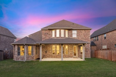 Experience the ultimate in luxury and privacy at 5221 Sylvan on The Tribute At the Colony in Texas - for sale on GolfHomes.com, golf home, golf lot