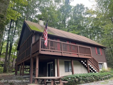Welcome to this charming log-sided retreat offering 3 bedrooms on The Hideout Golf in Pennsylvania - for sale on GolfHomes.com, golf home, golf lot