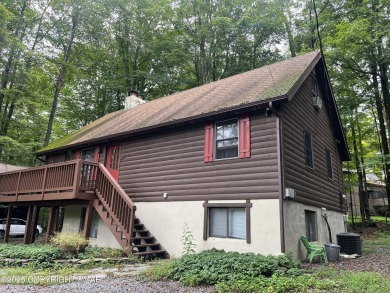 Welcome to this charming log-sided retreat offering 3 bedrooms on The Hideout Golf in Pennsylvania - for sale on GolfHomes.com, golf home, golf lot