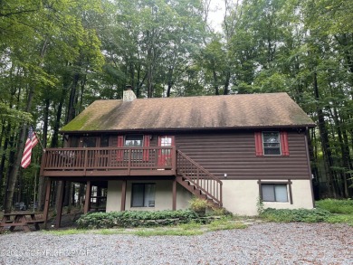 Welcome to this charming log-sided retreat offering 3 bedrooms on The Hideout Golf in Pennsylvania - for sale on GolfHomes.com, golf home, golf lot