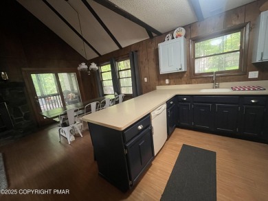Welcome to this charming log-sided retreat offering 3 bedrooms on The Hideout Golf in Pennsylvania - for sale on GolfHomes.com, golf home, golf lot