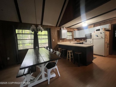 Welcome to this charming log-sided retreat offering 3 bedrooms on The Hideout Golf in Pennsylvania - for sale on GolfHomes.com, golf home, golf lot