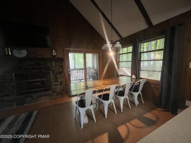 Welcome to this charming log-sided retreat offering 3 bedrooms on The Hideout Golf in Pennsylvania - for sale on GolfHomes.com, golf home, golf lot