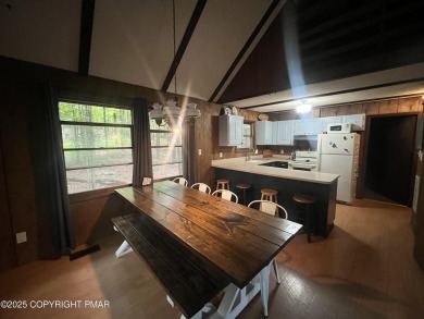 Welcome to this charming log-sided retreat offering 3 bedrooms on The Hideout Golf in Pennsylvania - for sale on GolfHomes.com, golf home, golf lot