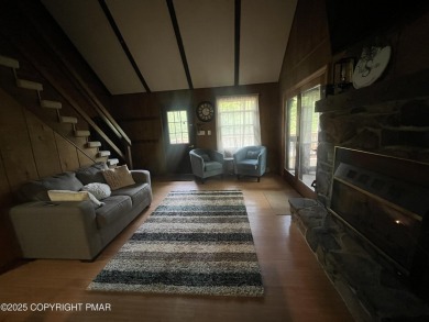 Welcome to this charming log-sided retreat offering 3 bedrooms on The Hideout Golf in Pennsylvania - for sale on GolfHomes.com, golf home, golf lot