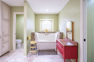 This sweet home, nestled on the 5th hole of Green Tree golf on Green Tree Country Club in Texas - for sale on GolfHomes.com, golf home, golf lot