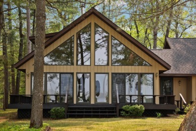 STUNNING WATERFRONT LAKE HOME! This remarkable lakefront on Garland Resort and Golf Club  in Michigan - for sale on GolfHomes.com, golf home, golf lot