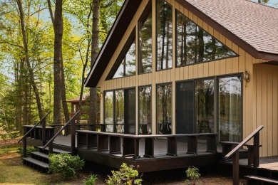 STUNNING WATERFRONT LAKE HOME! This remarkable lakefront on Garland Resort and Golf Club  in Michigan - for sale on GolfHomes.com, golf home, golf lot