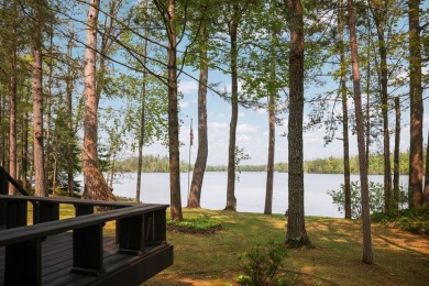STUNNING WATERFRONT LAKE HOME! This remarkable lakefront on Garland Resort and Golf Club  in Michigan - for sale on GolfHomes.com, golf home, golf lot