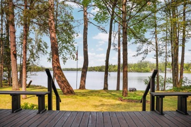 STUNNING WATERFRONT LAKE HOME! This remarkable lakefront on Garland Resort and Golf Club  in Michigan - for sale on GolfHomes.com, golf home, golf lot