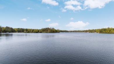 STUNNING WATERFRONT LAKE HOME! This remarkable lakefront on Garland Resort and Golf Club  in Michigan - for sale on GolfHomes.com, golf home, golf lot