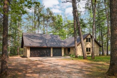 STUNNING WATERFRONT LAKE HOME! This remarkable lakefront on Garland Resort and Golf Club  in Michigan - for sale on GolfHomes.com, golf home, golf lot
