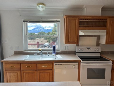 Here's a true beauty of a home nestled in the heart of Southern on Walsenburg Golf Club in Colorado - for sale on GolfHomes.com, golf home, golf lot