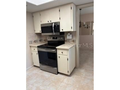 Updated and beautifully maintained 2bd/2bath plus Bonus Room on Cypresswood Golf and Country Club in Florida - for sale on GolfHomes.com, golf home, golf lot