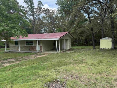 This property sits on 3 spacious lots with mature trees offering on The Course At Turkey Mountain in Arkansas - for sale on GolfHomes.com, golf home, golf lot