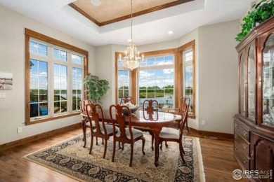 This custom ranch home on a stunning waterfront lot offers an on Pelican Lakes Golf and Country Club in Colorado - for sale on GolfHomes.com, golf home, golf lot