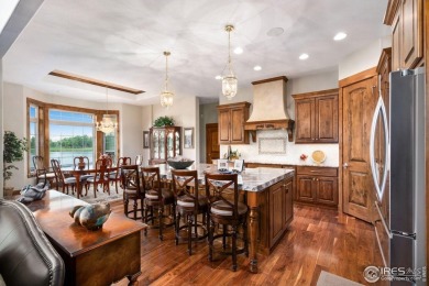 This custom ranch home on a stunning waterfront lot offers an on Pelican Lakes Golf and Country Club in Colorado - for sale on GolfHomes.com, golf home, golf lot