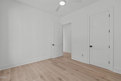 Modern Ranch Farmhouse with Golf Course Views. Built less than on Chapel Ridge Golf Club in North Carolina - for sale on GolfHomes.com, golf home, golf lot