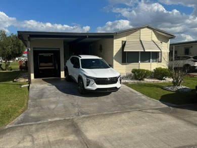 This home has so much to offer it's hard to even decide where to on Golden Lakes Golf Course in Florida - for sale on GolfHomes.com, golf home, golf lot
