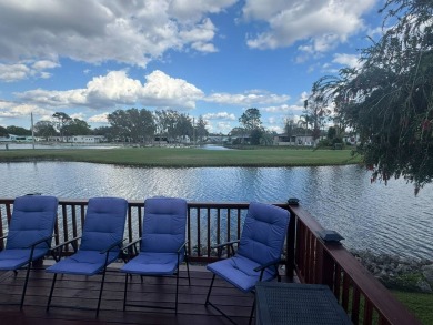 This home has so much to offer it's hard to even decide where to on Golden Lakes Golf Course in Florida - for sale on GolfHomes.com, golf home, golf lot