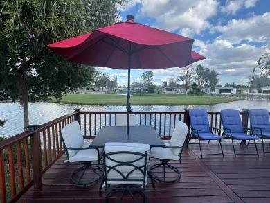 This home has so much to offer it's hard to even decide where to on Golden Lakes Golf Course in Florida - for sale on GolfHomes.com, golf home, golf lot
