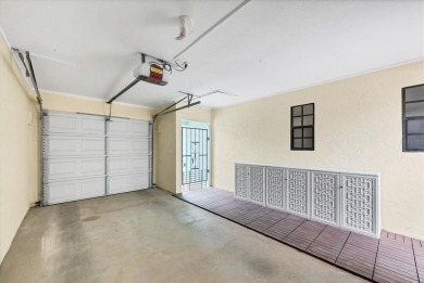 Discover effortless coastal charm in this rare end-unit villa on Rotonda Golf and Country Club The Palms Course in Florida - for sale on GolfHomes.com, golf home, golf lot