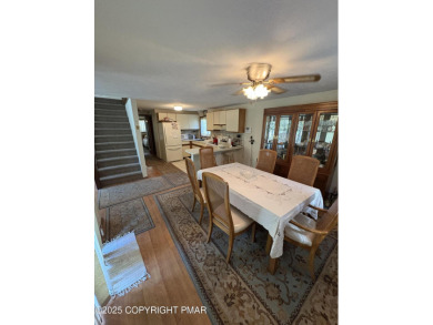 Spacious 3 bedroom home with fireplace and unfinished basement on Pocono Farms Country Club in Pennsylvania - for sale on GolfHomes.com, golf home, golf lot
