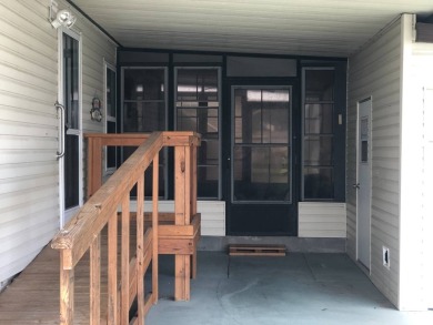 Located in the desirable gated, 55+ community this charming on Golden Lakes Golf Course in Florida - for sale on GolfHomes.com, golf home, golf lot