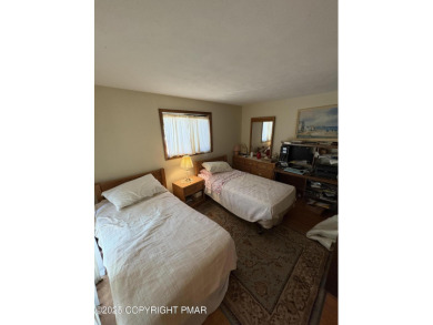 Spacious 3 bedroom home with fireplace and unfinished basement on Pocono Farms Country Club in Pennsylvania - for sale on GolfHomes.com, golf home, golf lot