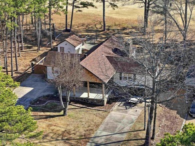 Welcome to 313 Snead Dr. in Fairfield Bay, perfectly positioned on Indian Hills Country Club in Arkansas - for sale on GolfHomes.com, golf home, golf lot