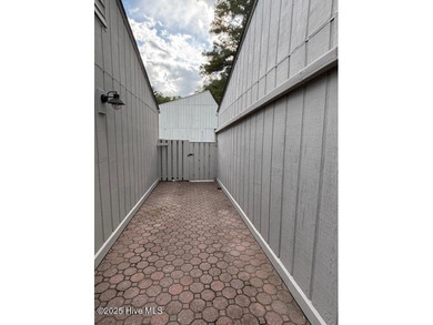 Discover this stunning 3-bedroom, 3-bath townhouse with a 2-car on Woodlake Country Club in North Carolina - for sale on GolfHomes.com, golf home, golf lot