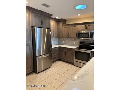 Discover this stunning 3-bedroom, 3-bath townhouse with a 2-car on Woodlake Country Club in North Carolina - for sale on GolfHomes.com, golf home, golf lot