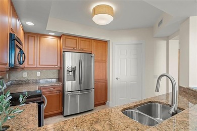 Enjoy peaceful panoramic views from this sophisticated 6th-floor on The Colony Golf and Country Club in Florida - for sale on GolfHomes.com, golf home, golf lot