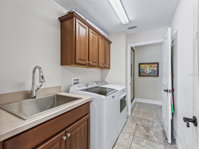 This Custom expanded Gardenia Model has pictuesqes views through on Glenview Championship Golf and Country Club in Florida - for sale on GolfHomes.com, golf home, golf lot