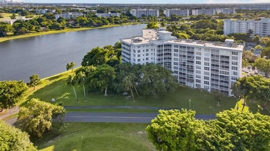 Enjoy breathtaking panoramic LAKE VIEWS & all-day natural light on Palm-Aire Country Club and Resort - Palms in Florida - for sale on GolfHomes.com, golf home, golf lot