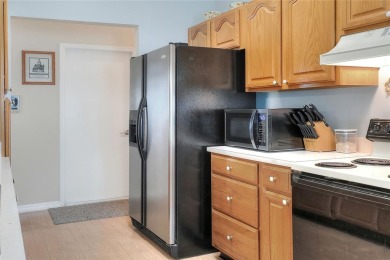 Welcome to this delightful 2-bedroom, 2-bathroom home with a on Sandpiper Golf Club in Florida - for sale on GolfHomes.com, golf home, golf lot
