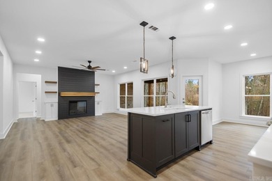 Step inside this beautiful new 4 bed, 2.5 bath home and fall in on Silver Springs Country Club in Arkansas - for sale on GolfHomes.com, golf home, golf lot