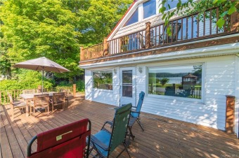 It is time to take the plunge and own a home on beautiful on Tennanah Lake Golf & Tennis in New York - for sale on GolfHomes.com, golf home, golf lot