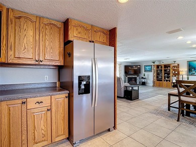 Must see beautiful waterfront pool home in the highly sought on Gulf Harbors Golf Course in Florida - for sale on GolfHomes.com, golf home, golf lot