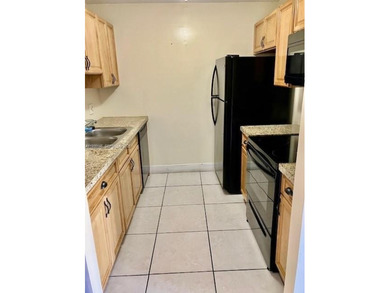 REMODELED, SPACIOUS, 1BR 1.5 BA, CONVENIENTLY LOCATED ON 1ST on Flamingo Lakes Country Club in Florida - for sale on GolfHomes.com, golf home, golf lot
