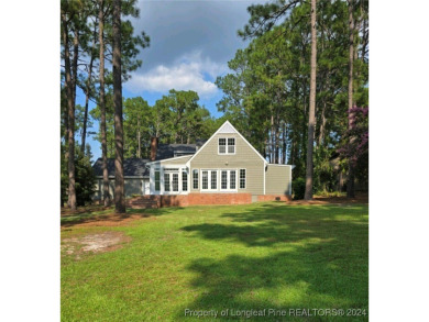 This 4-bedroom, 3.1-bath waterfront property is nestled in the on Gates Four Golf and Country Club in North Carolina - for sale on GolfHomes.com, golf home, golf lot