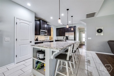 Spacious 5-bed, 3-bath home w/ a 3-car garage on over an acre in on Lost Plantation Golf Club in Georgia - for sale on GolfHomes.com, golf home, golf lot