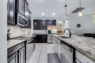 Spacious 5-bed, 3-bath home w/ a 3-car garage on over an acre in on Lost Plantation Golf Club in Georgia - for sale on GolfHomes.com, golf home, golf lot