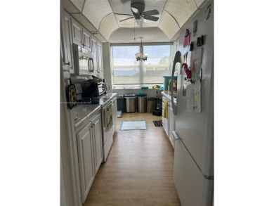 Large corner unit rarely available with a golf and garden view on Pembroke Lakes Golf Club in Florida - for sale on GolfHomes.com, golf home, golf lot