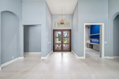 Discover luxury living at 326 Charroux Drive in prestigious on Frenchmans Reserve in Florida - for sale on GolfHomes.com, golf home, golf lot