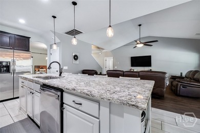 Spacious 5-bed, 3-bath home w/ a 3-car garage on over an acre in on Lost Plantation Golf Club in Georgia - for sale on GolfHomes.com, golf home, golf lot