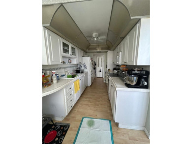 Large corner unit rarely available with a golf and garden view on Pembroke Lakes Golf Club in Florida - for sale on GolfHomes.com, golf home, golf lot