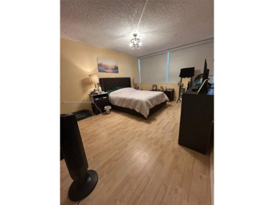 Large corner unit rarely available with a golf and garden view on Pembroke Lakes Golf Club in Florida - for sale on GolfHomes.com, golf home, golf lot
